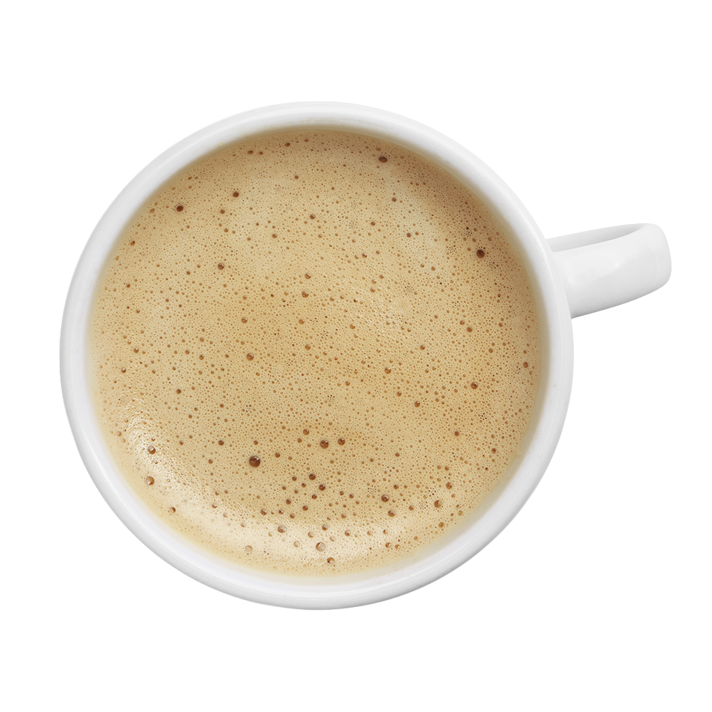 Taza de café con leche Puleva vista desde arriba con espuma cremosa