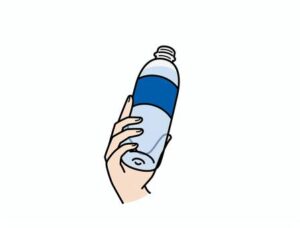 Mano sujetando botella de leche - producto de bebida láctea Puleva